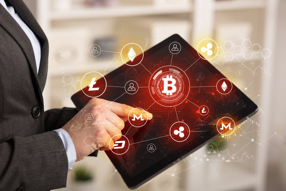 Business woman using tablet with cryptocurrency bitcoin link network concept-1